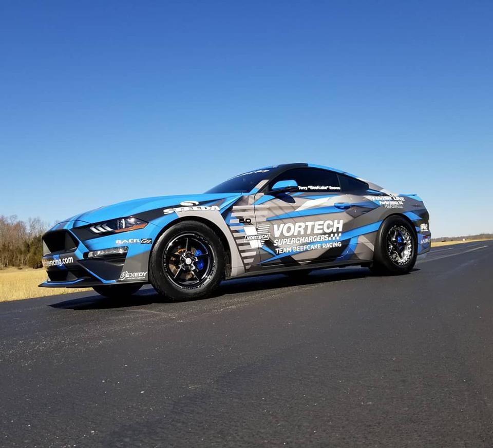blue mustang gt on road